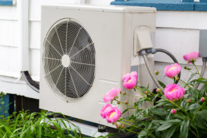 Heat Pumps - A heat pump unit on the side of a home